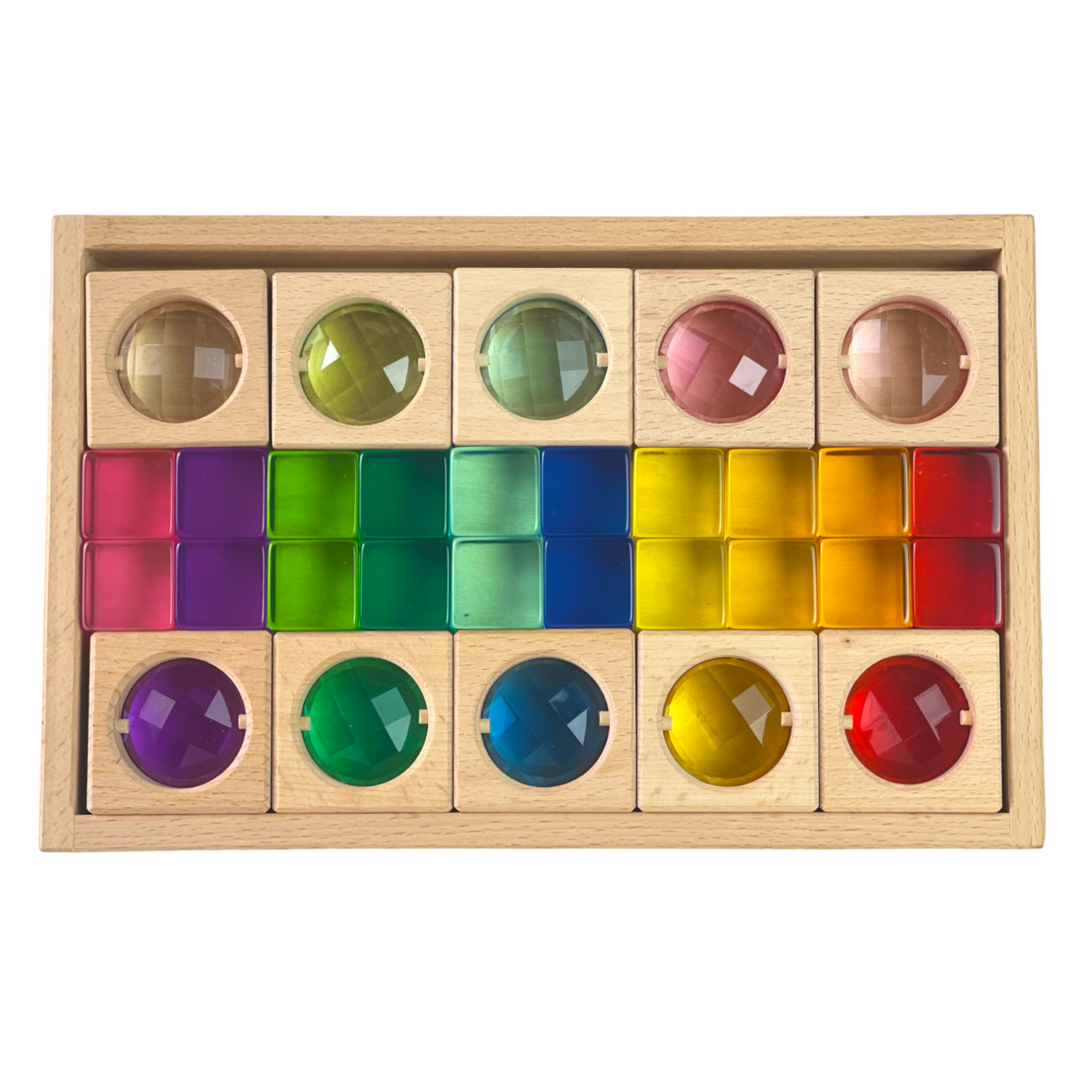 Ten wooden gem window blocks and twenty rainbow lucite cubes arranged in a storage tray