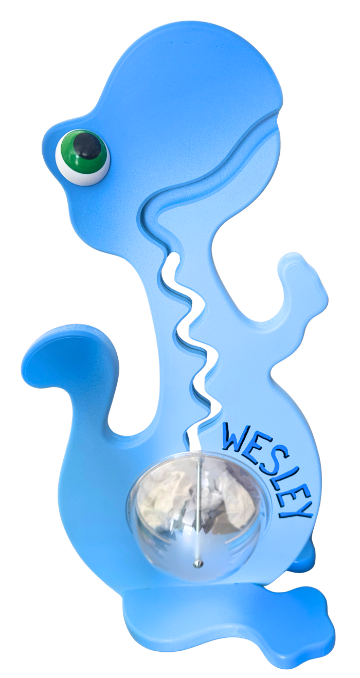 Blue dinosaur bank containing coins, showing an example of personalized name lettering