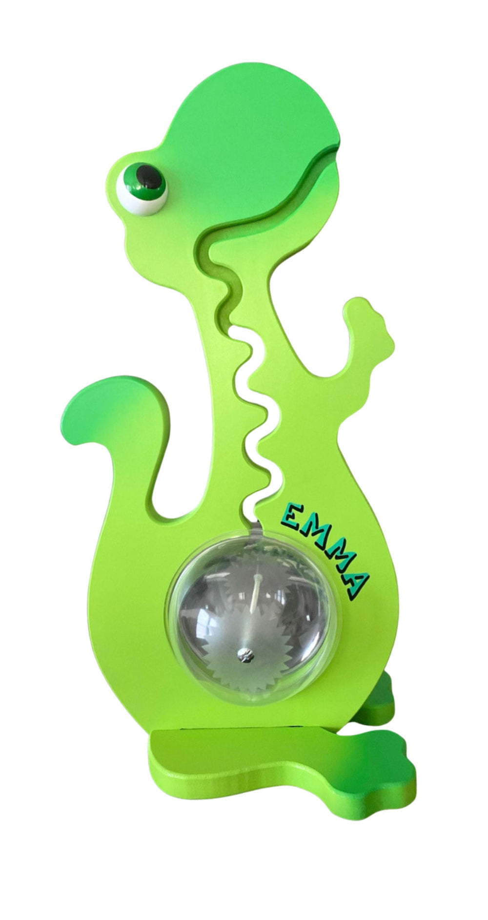 Green dinosaur bank containing coins, showing an example of personalized name lettering
