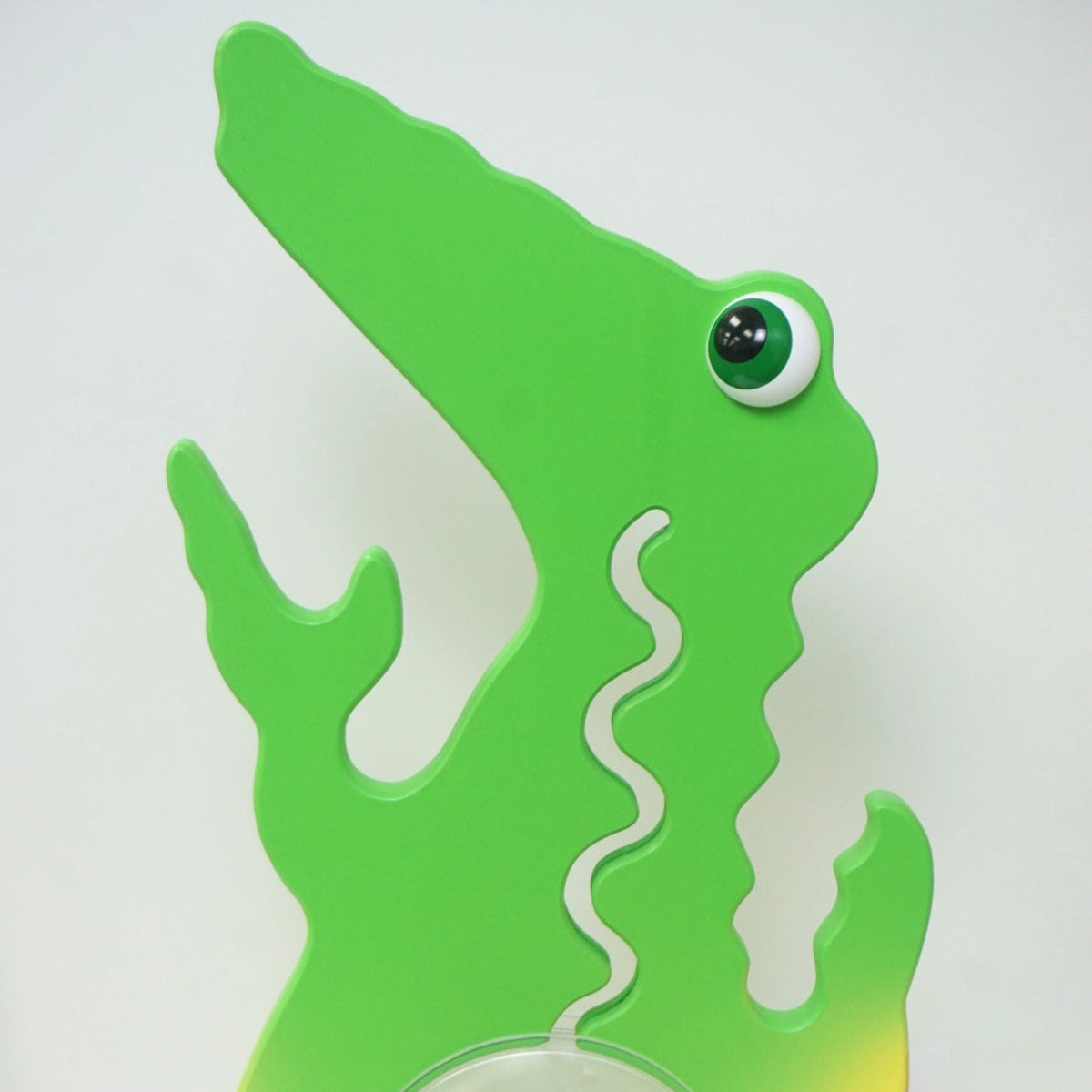 Reverse-side close-up of the green alligator head and upper body
