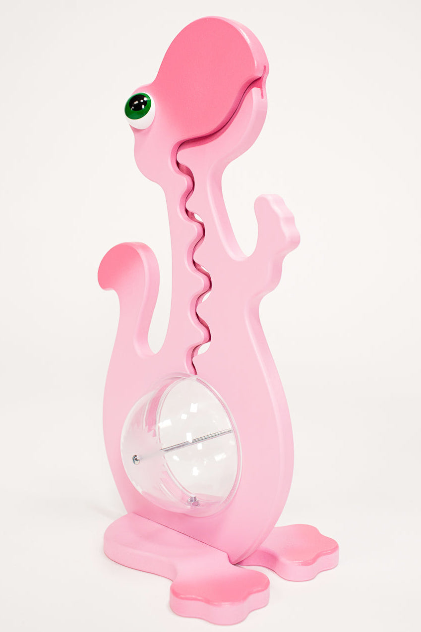 Angled view of the pink dinosaur coin bank