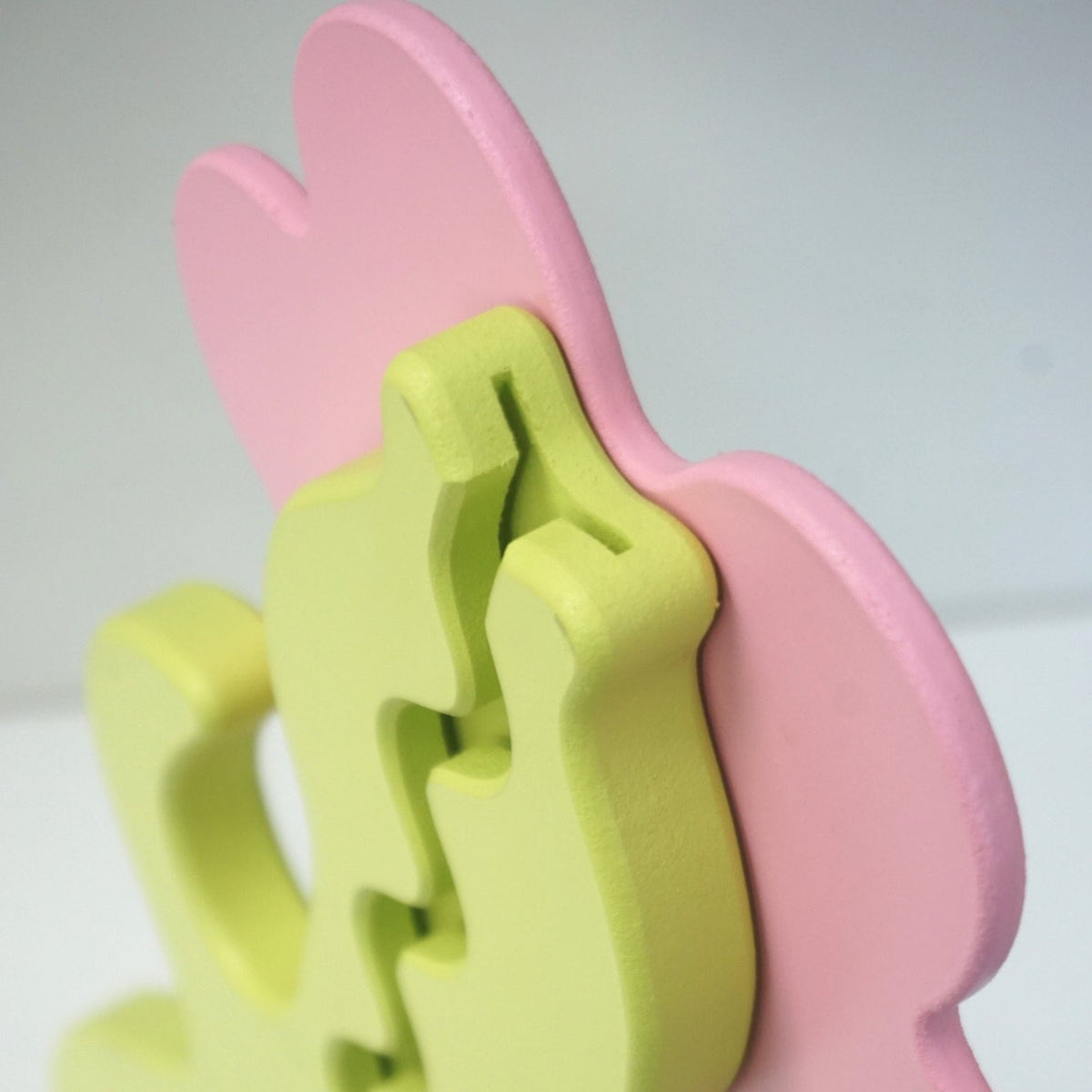 Side close-up of the flower bank coin-entry slot behind the petals