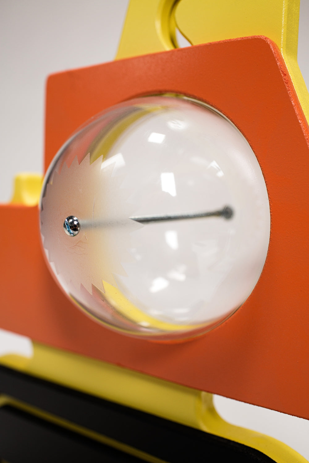 Close-up of the excavator bank clear belly, metal bolt and orange body