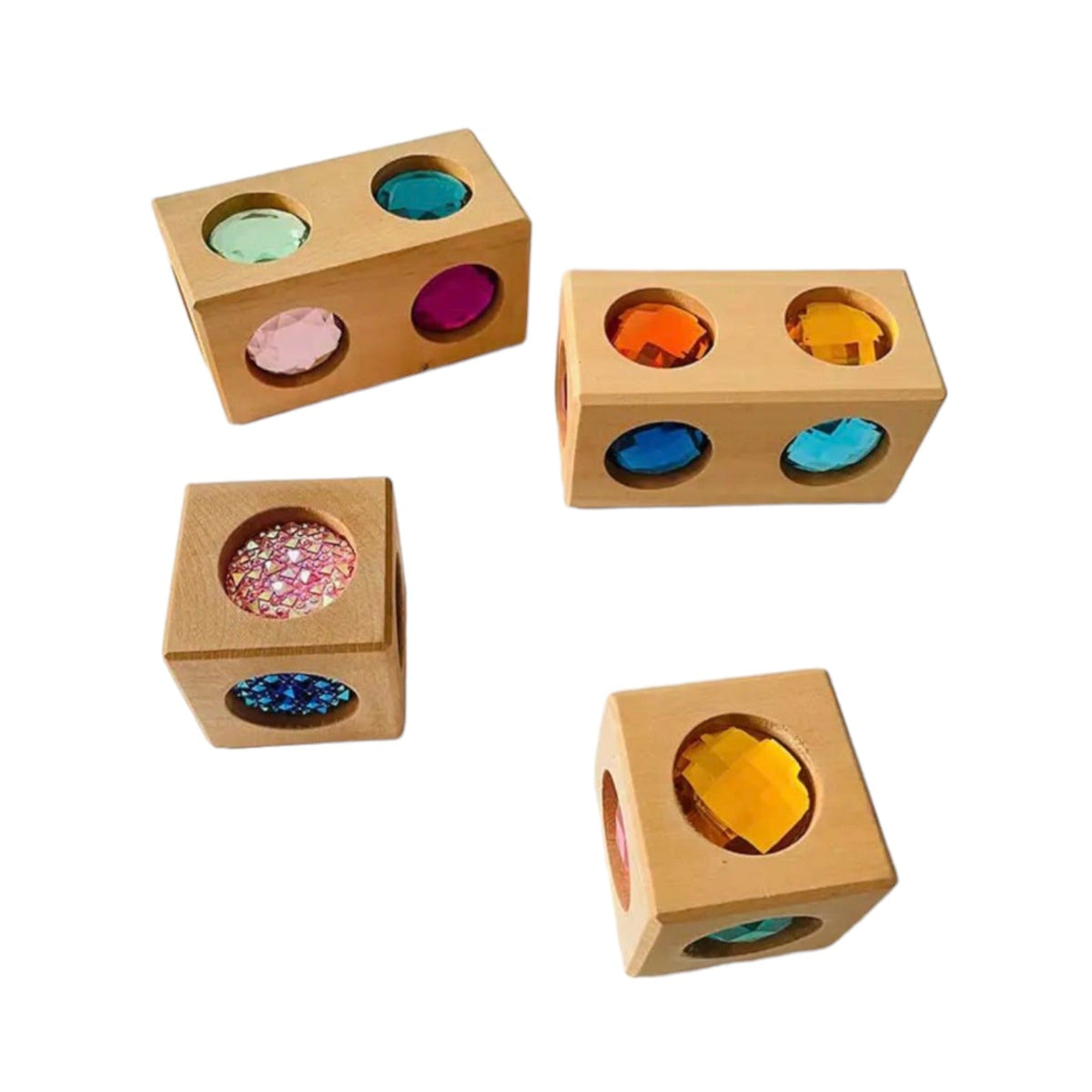 Four basswood cube and cuboid gem blocks with colorful faces