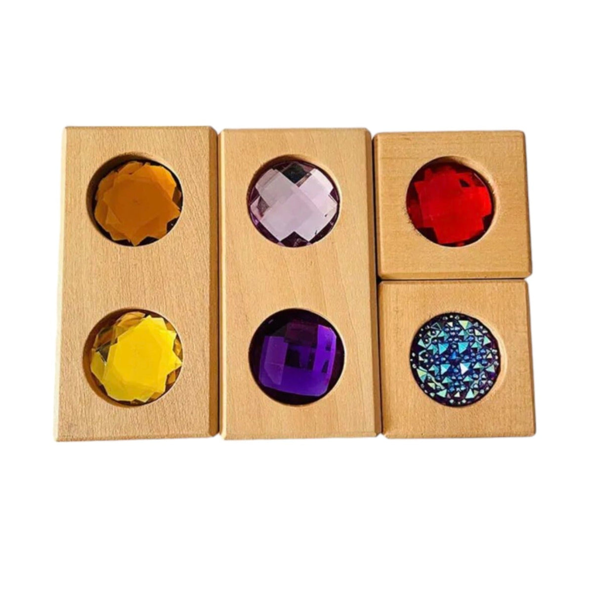 Four wooden gem blocks arranged to show colored sides