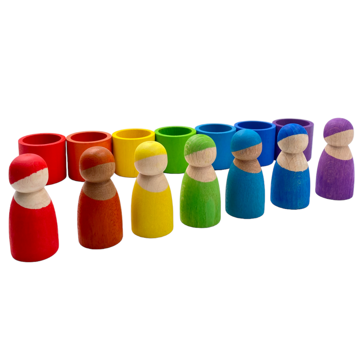 Rainbow peg dolls lined up in front of their matching empty bowls
