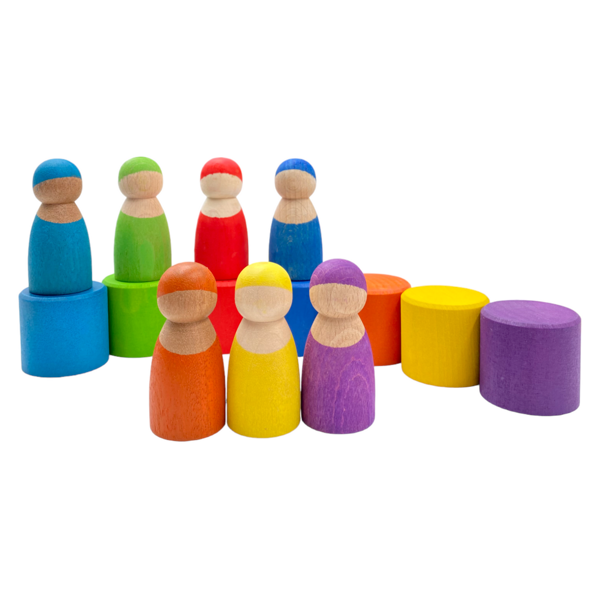 Wooden peg dolls arranged beside upright and inverted rainbow bowls