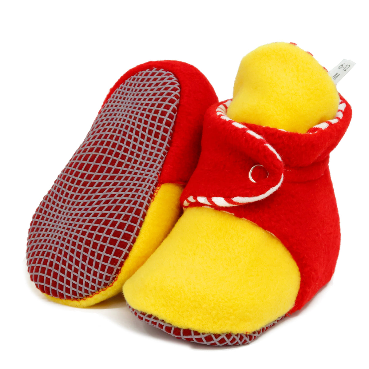 Red-and-yellow fleece baby booties with striped lining and snap straps, with one sole facing the camera on a white background.