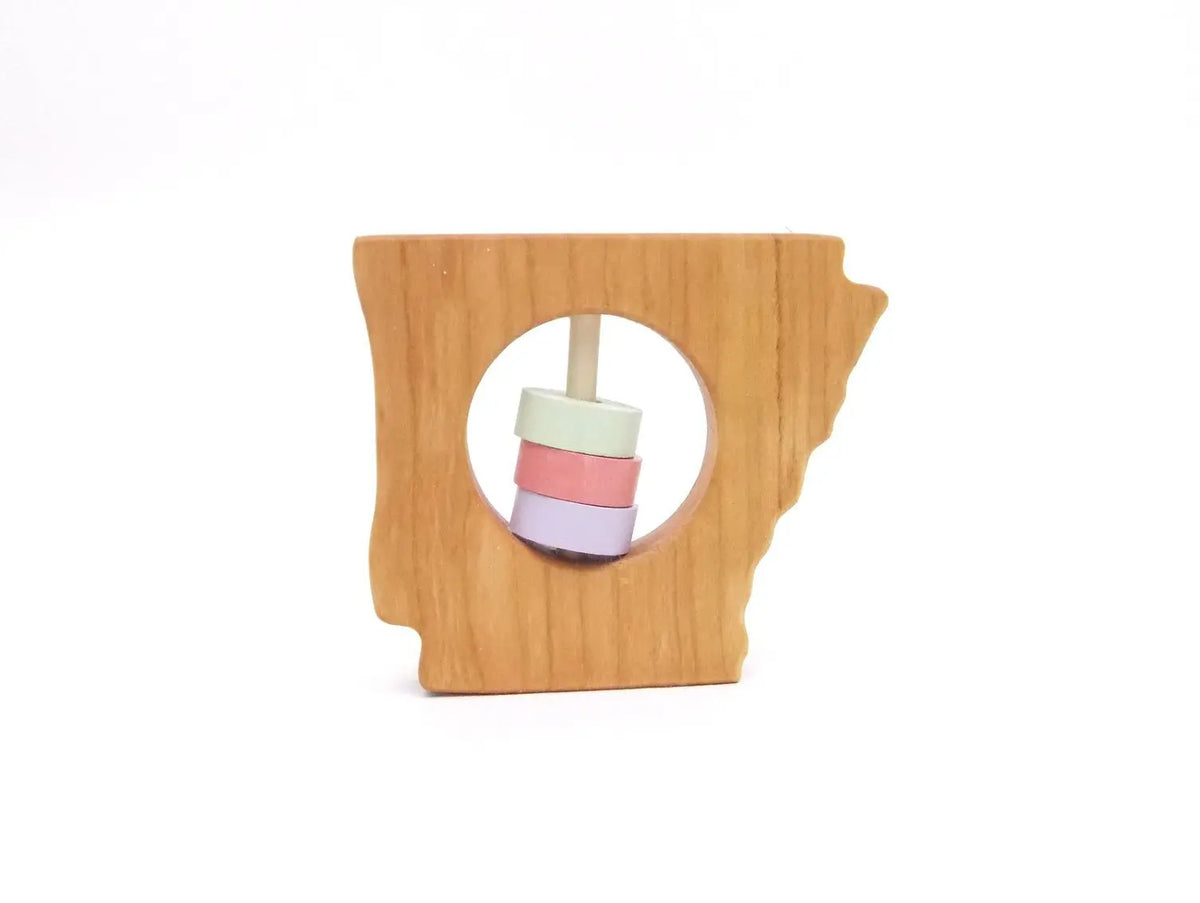 Bannor Toys Arkansas State Wooden Baby Rattle, showing state-shaped cherry-wood body and colored rattle discs
