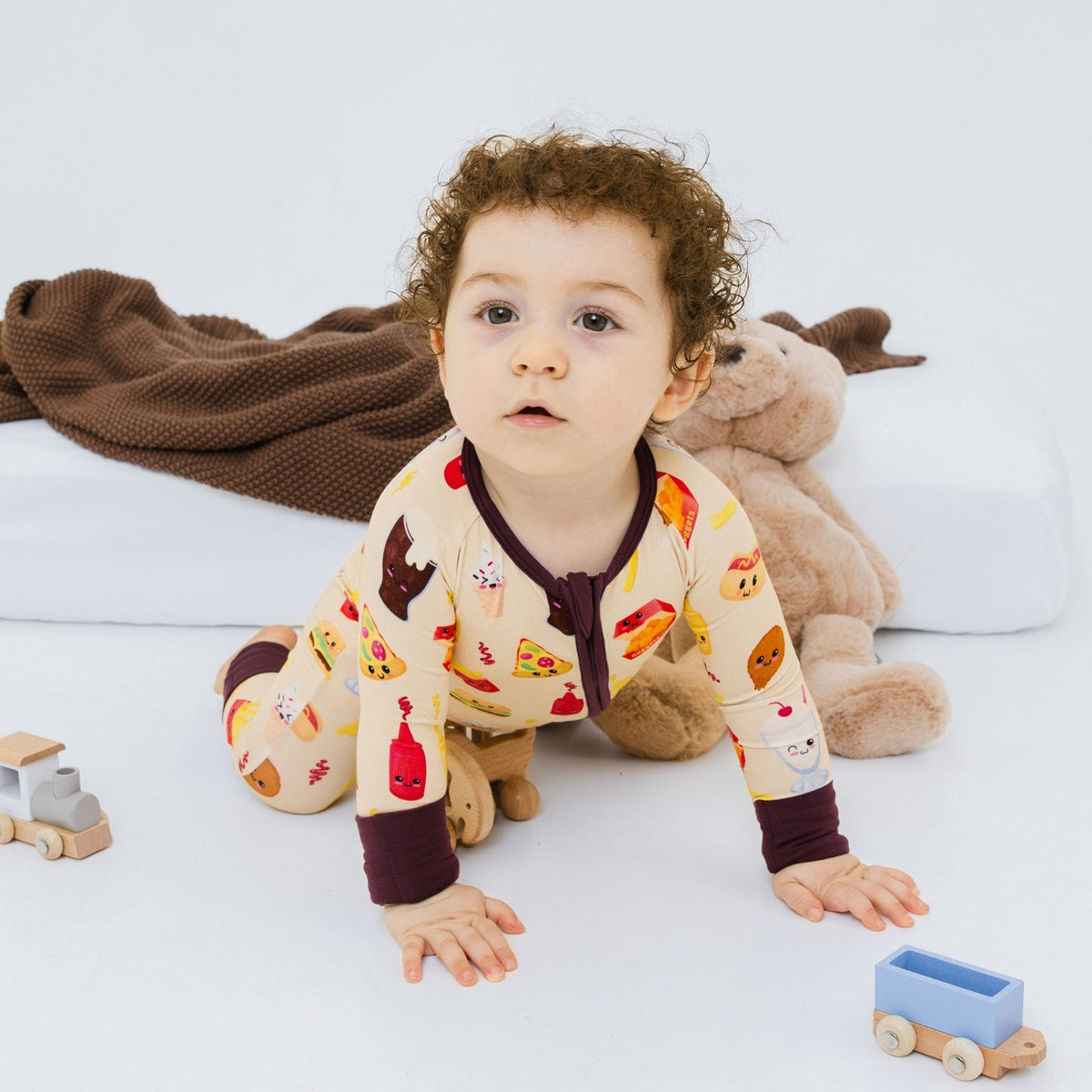 Baby on hands and knees wearing Bam & Stitch Blissful Bites Convertible Romper.