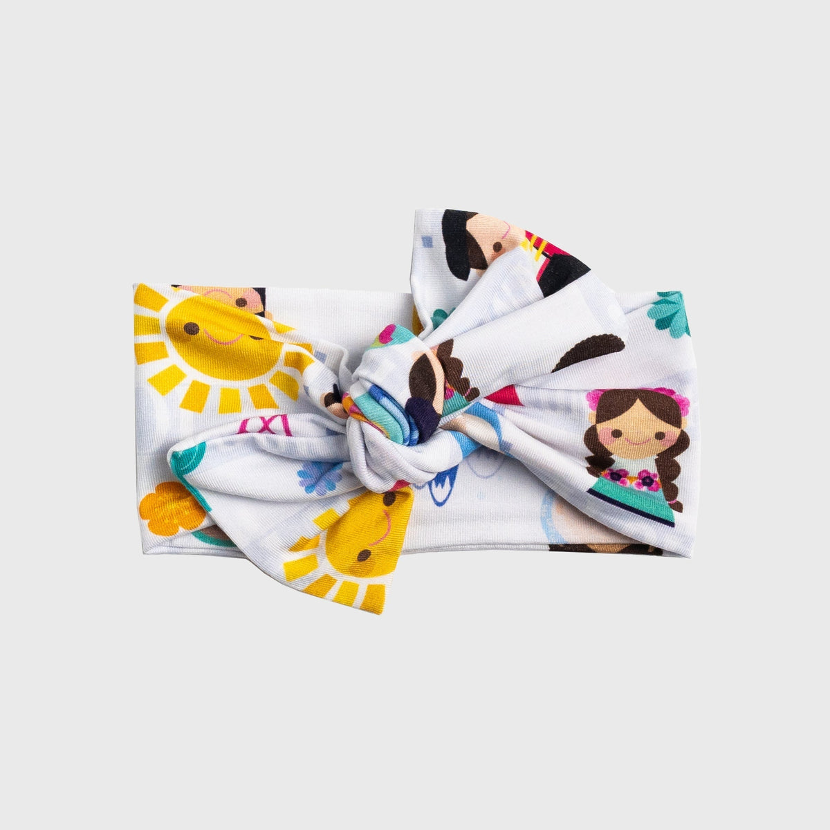 Flat lay of Bam & Stitch Children of the World Bow Headband, showing the bow and fabric band.