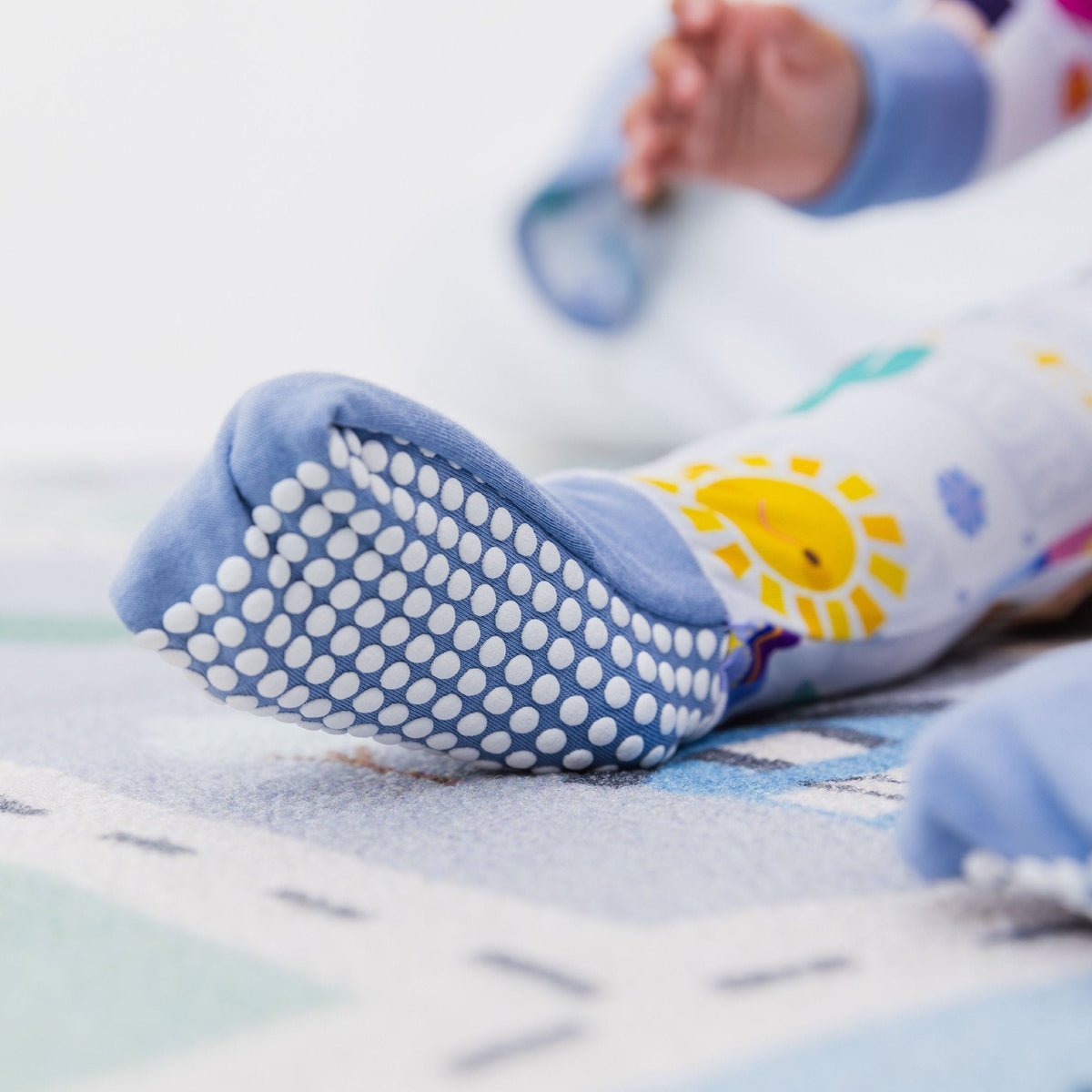 Close-up of the fold-over feet and dotted soles on Bam & Stitch Children of the World Convertible Romper.