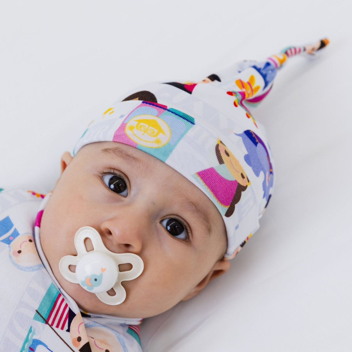 Close-up of a baby wearing Bam & Stitch Children of the World Hat.