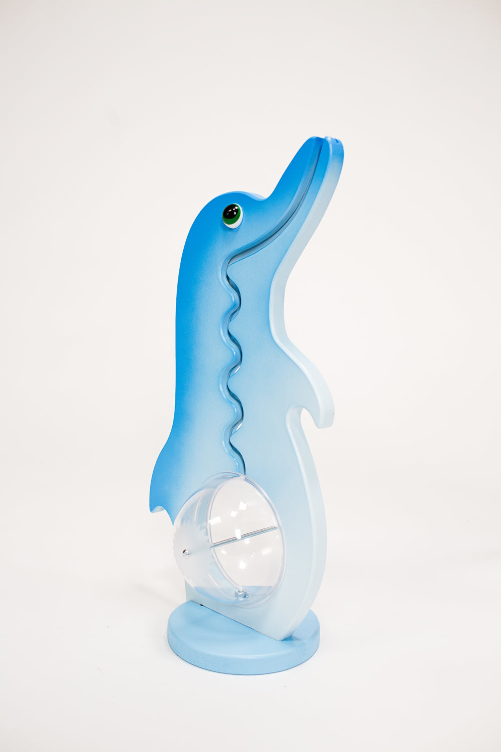Angled view of the blue and white dolphin coin bank