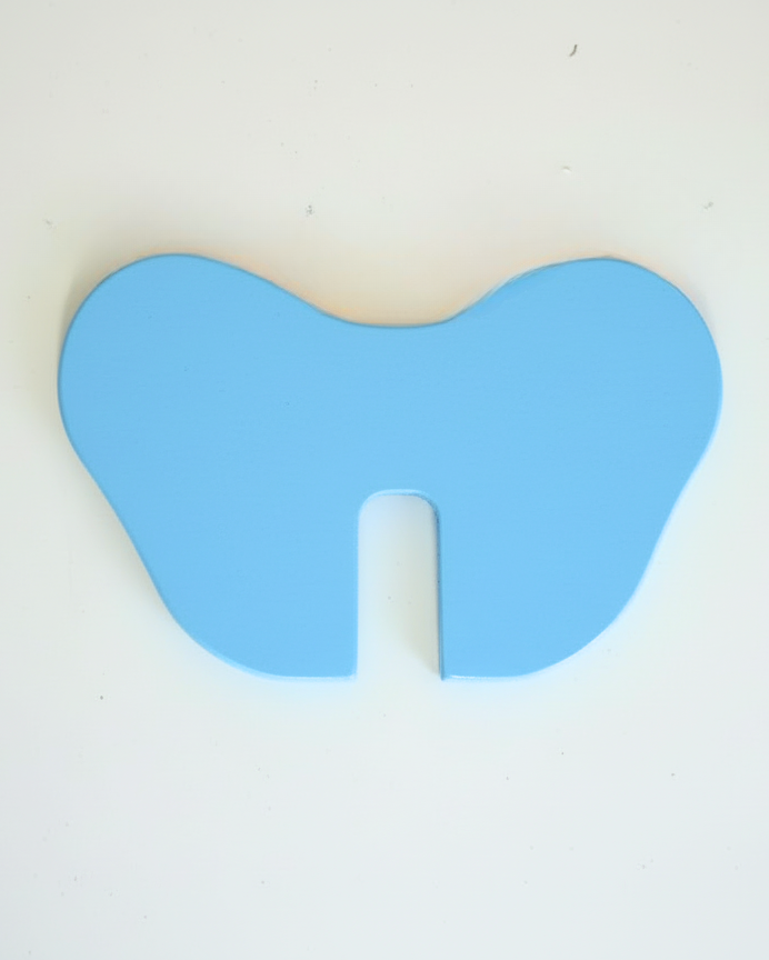 Blue ear piece with center cutout for the elephant coin bank