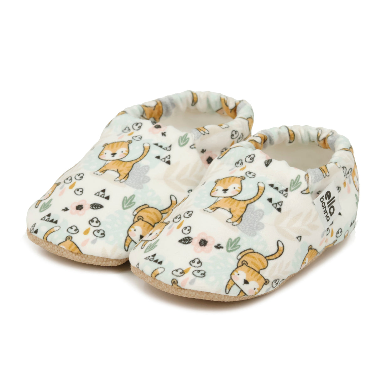 Pair of cream slip-on baby moccasins with small yellow cat print on a white background.