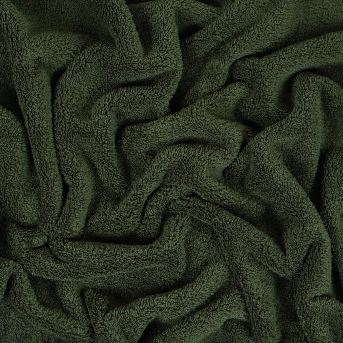 Olive green fleece blanket gathered to show texture.