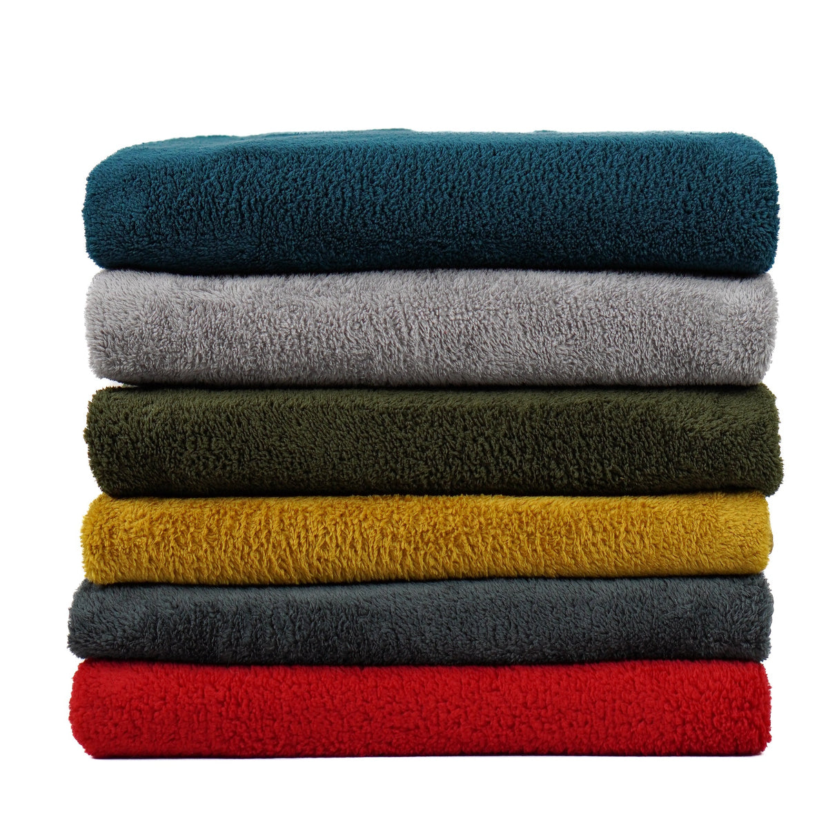 Front view of six stacked fleece blankets in assorted colors.