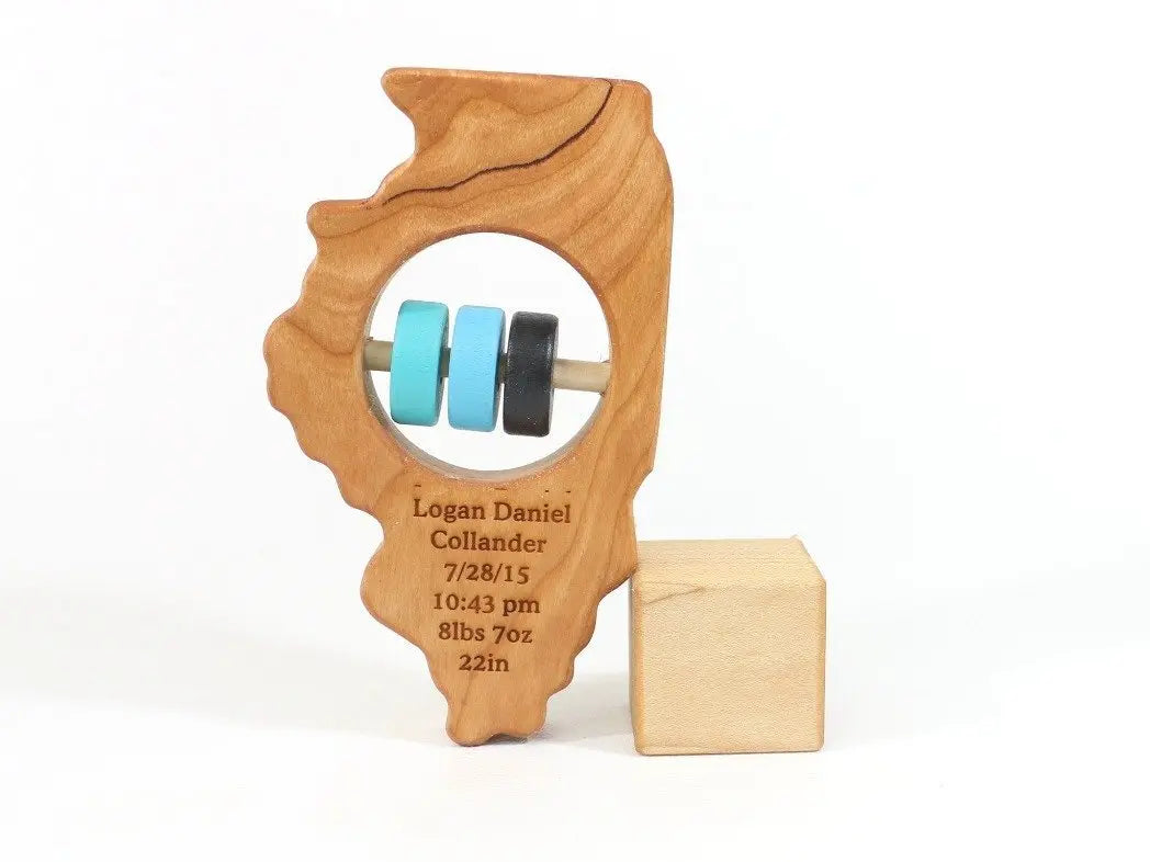 Bannor Toys Illinois State Wooden Baby Rattle with example laser engraving and colored rattle discs