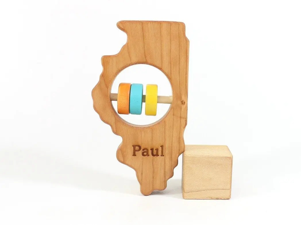Bannor Toys Illinois State Wooden Baby Rattle with example laser engraving and colored rattle discs