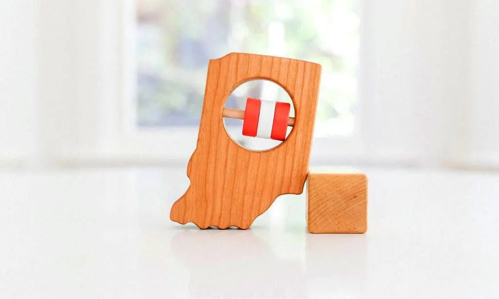 Bannor Toys Indiana State Wooden Baby Rattle, showing state-shaped cherry-wood body and colored rattle discs