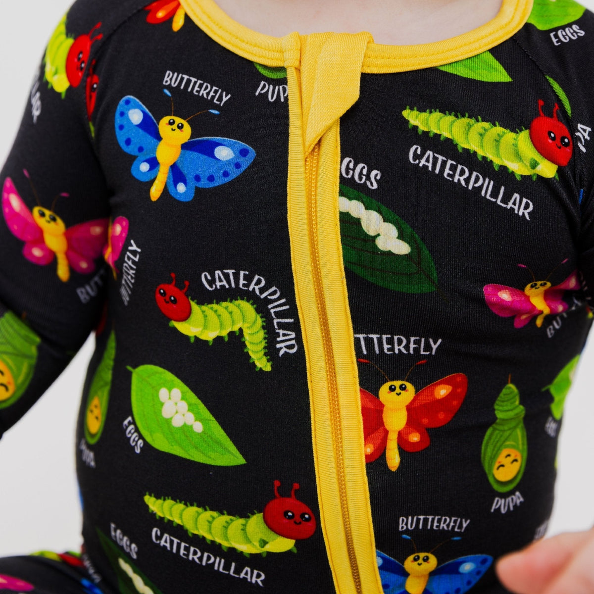 Close-up of the front zipper and fabric on Bam & Stitch It's Morphing Time! Convertible Romper.