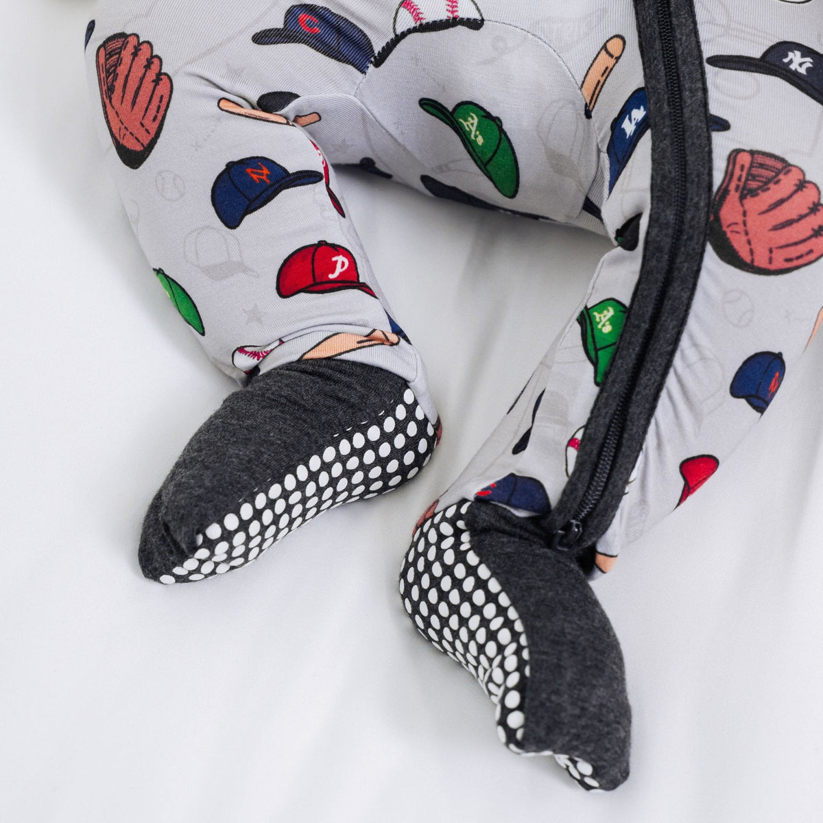 Close-up of the fold-over feet and dotted soles on Bam & Stitch Major League Buddies Convertible Romper.