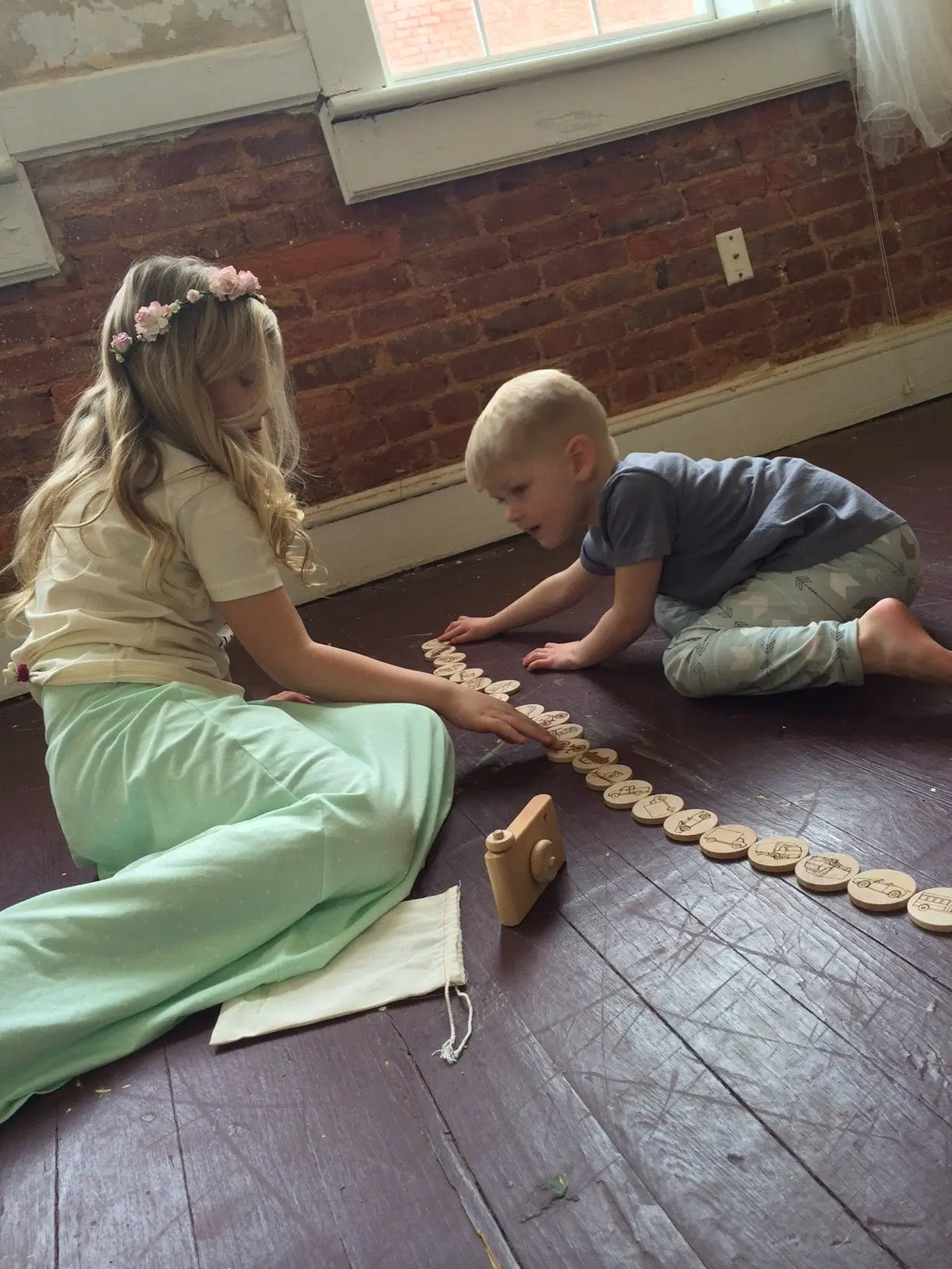 Lifestyle photo showing mini sight-word matching tiles with a child