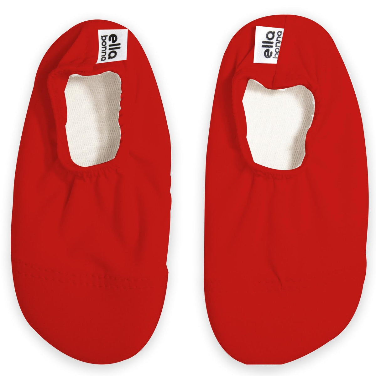 Top view of a pair of red slip-on water shoes with cream lining on a white background.