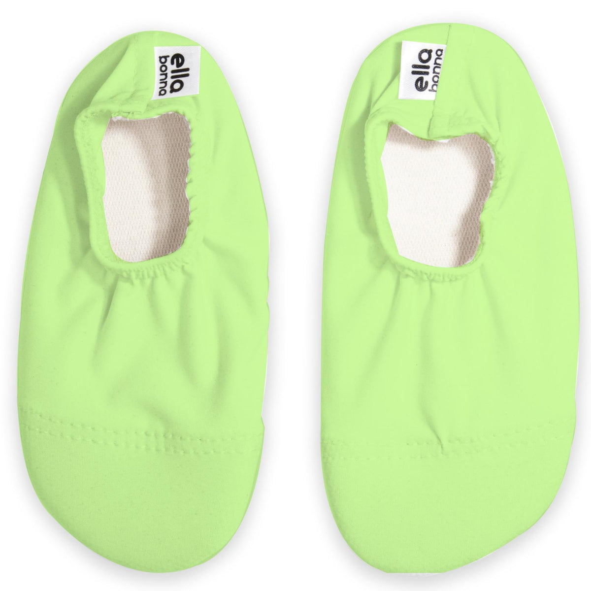 Top view of a pair of lime green slip-on water shoes with cream lining on a white background.