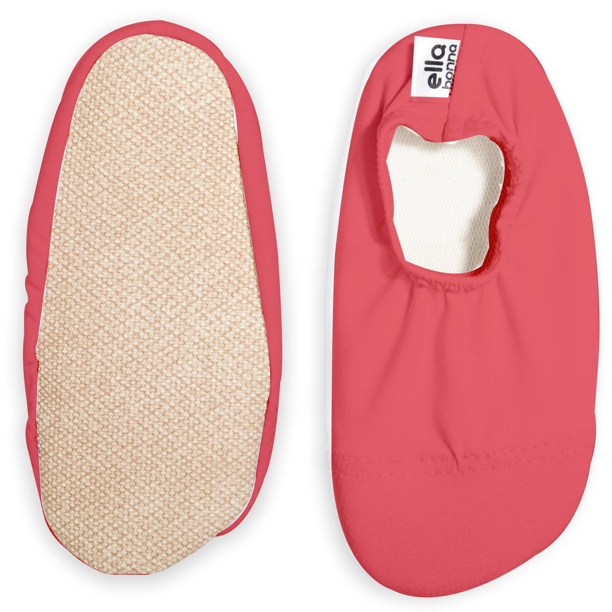 Bright pink slip-on water shoes with cream lining, with one sole facing the camera on a white background.