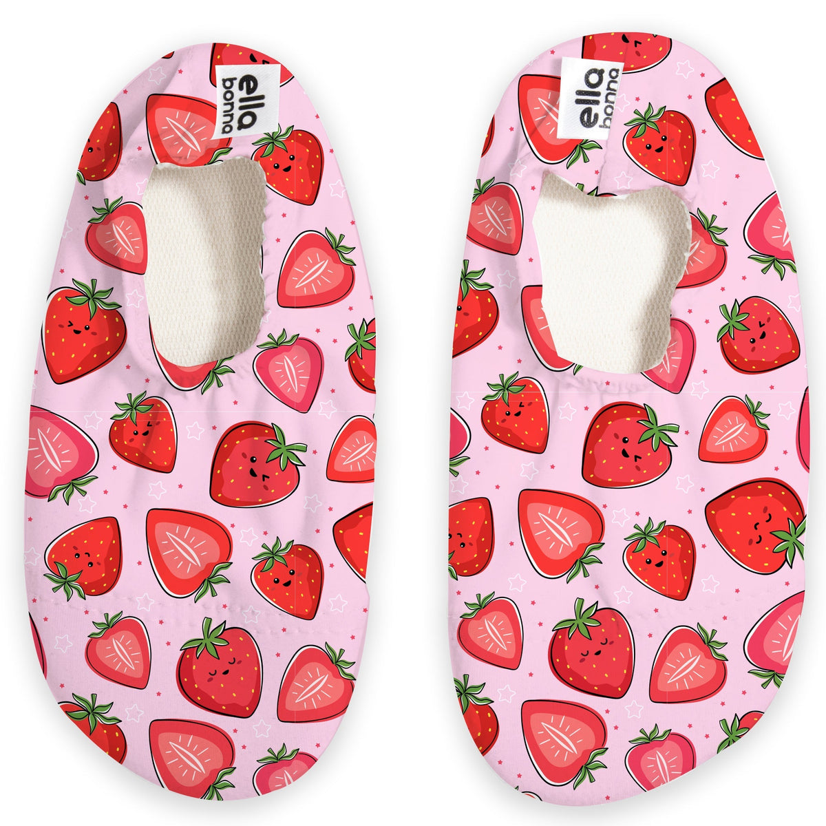 Top view of a pair of pale pink slip-on water shoes with red strawberry print on a white background.