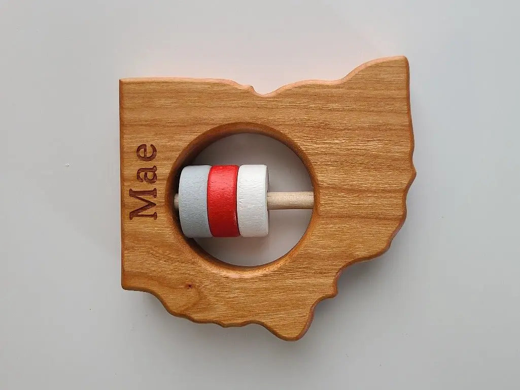 Bannor Toys Ohio State Wooden Baby Rattle, showing state-shaped cherry-wood body and colored rattle discs
