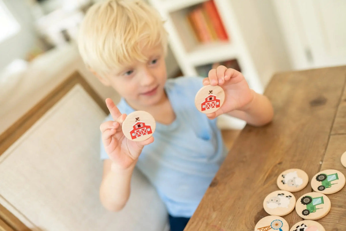 Lifestyle photo showing farm matching tiles with a child