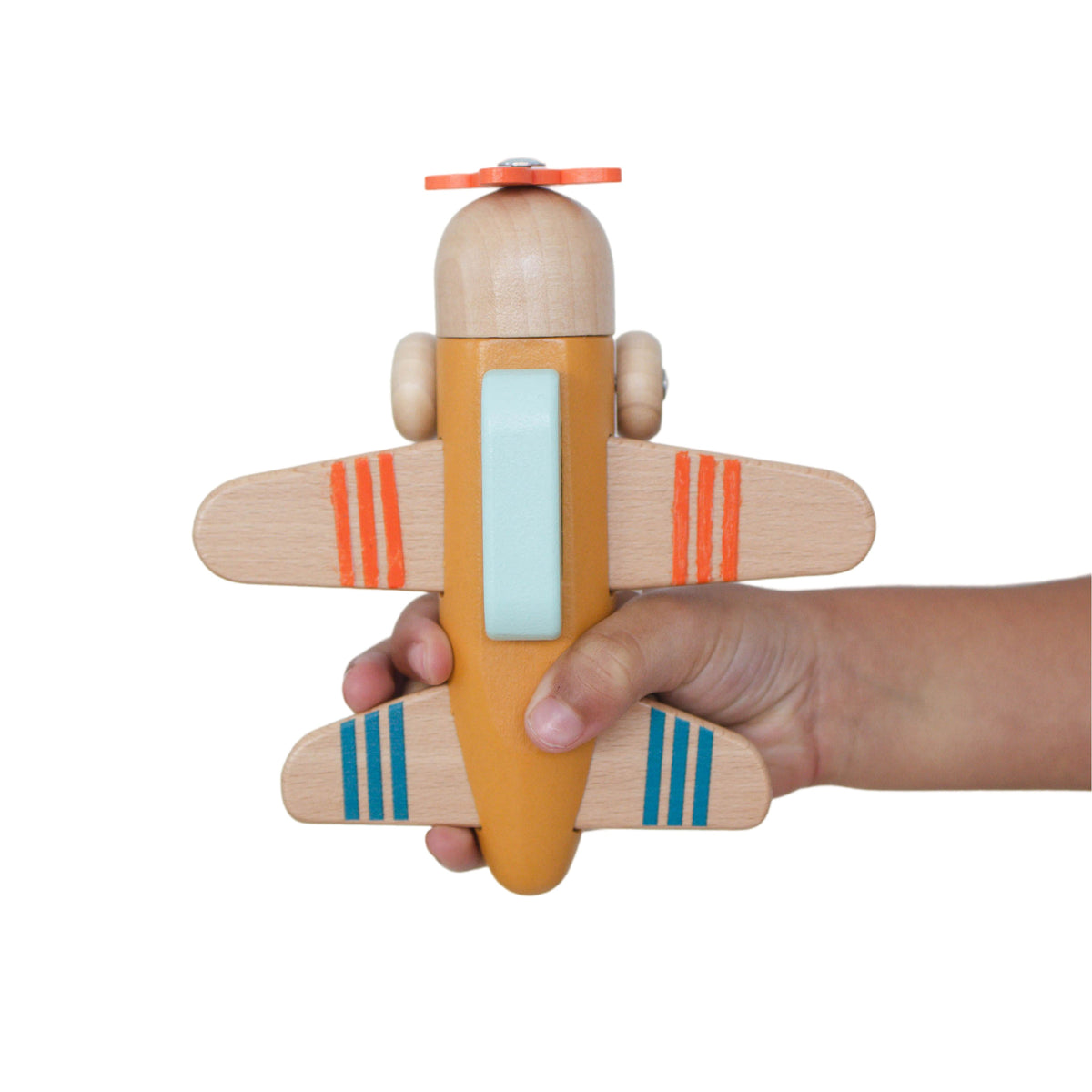 SpiritnSprout: Top view of the gold wooden airplane held in a hand