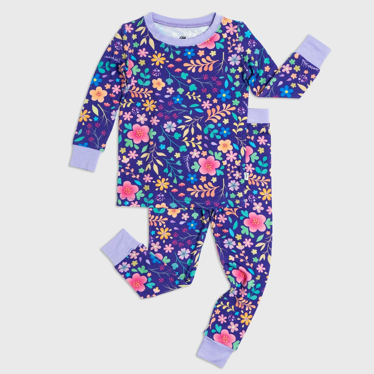 Flat lay of Bam & Stitch Orchid Gardens Long Sleeve Pajamas, showing the matching top and bottoms.
