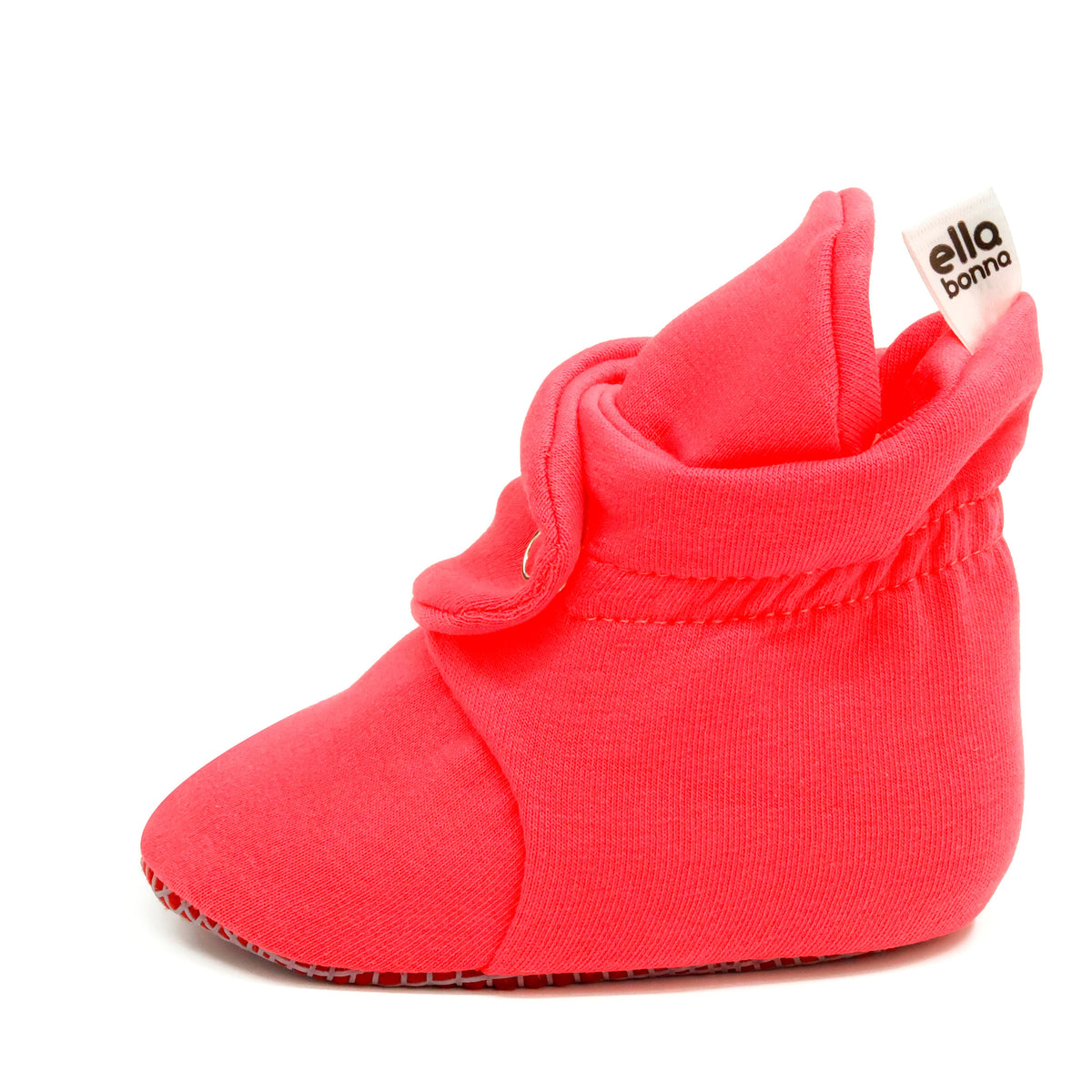 Single red bootie, side view on white.