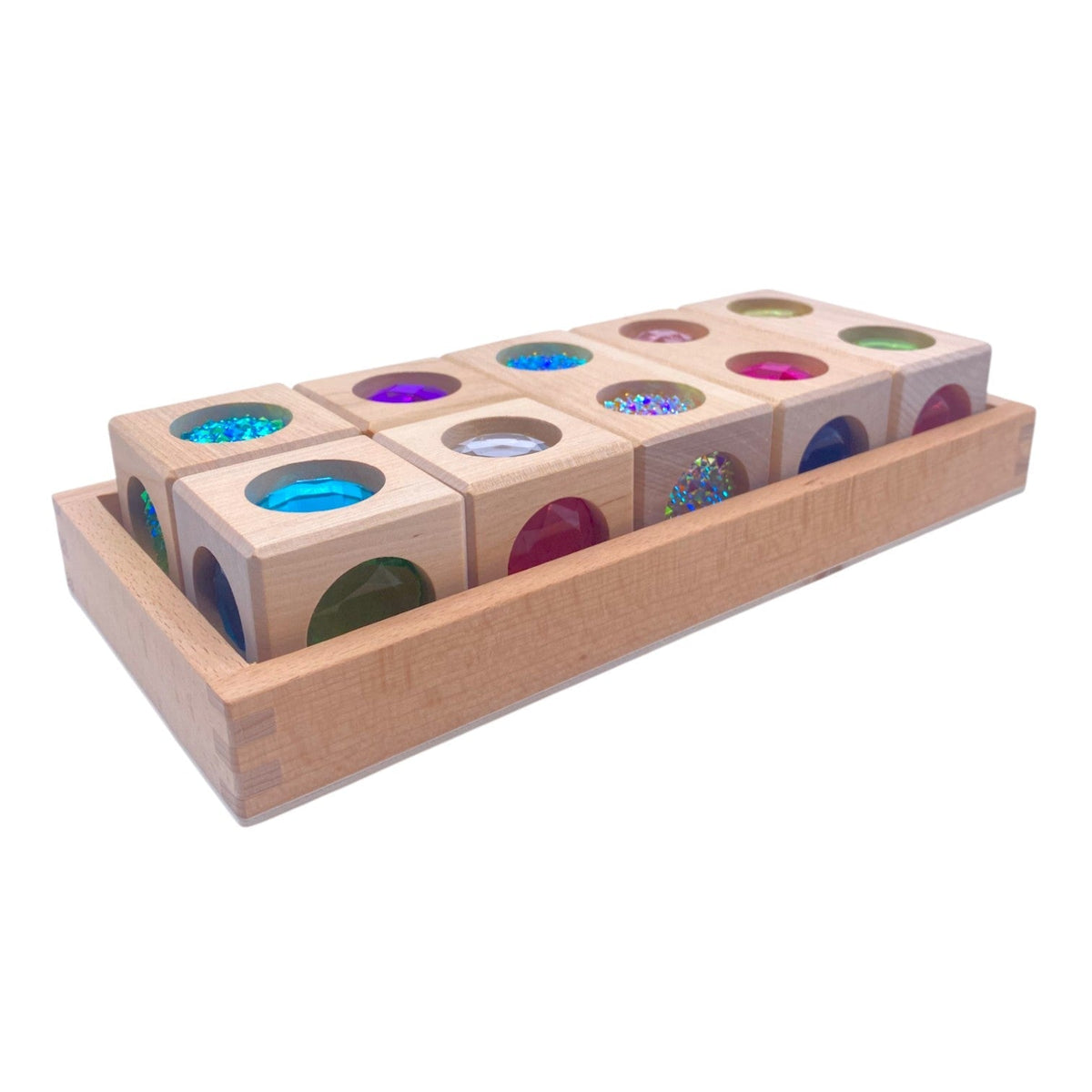 Style C rainbow 3D gem blocks in a tray showing gems on several faces