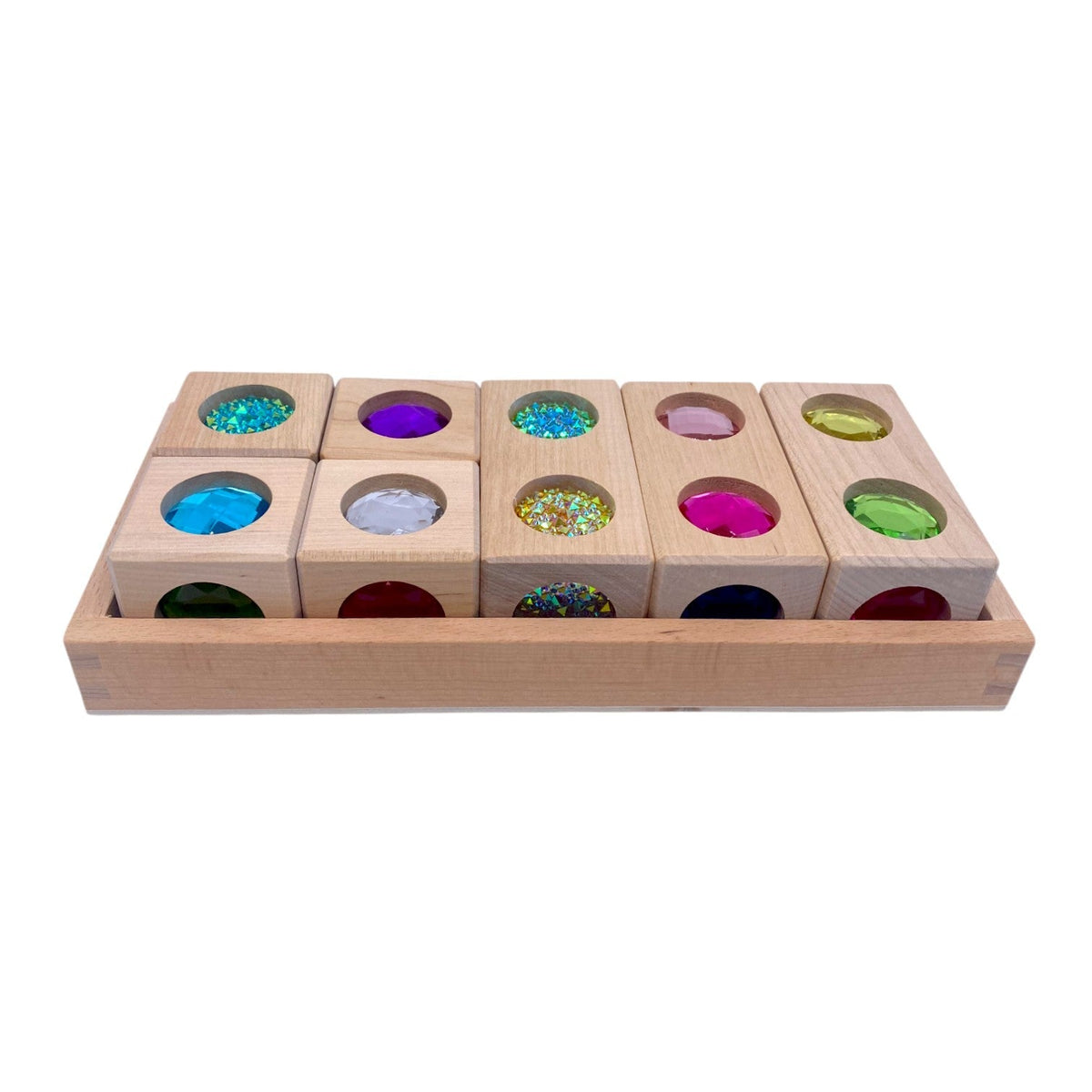 Front view of Style C seven rainbow 3D gem blocks in the wooden tray