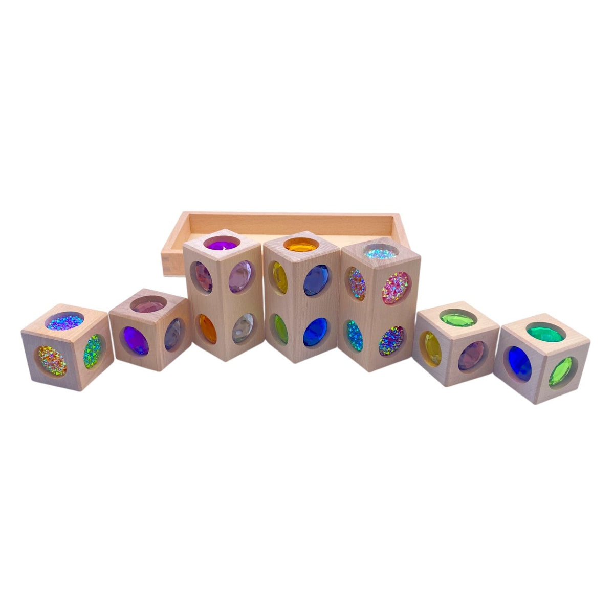 Seven Style C 3D gem blocks arranged in a row beside the tray