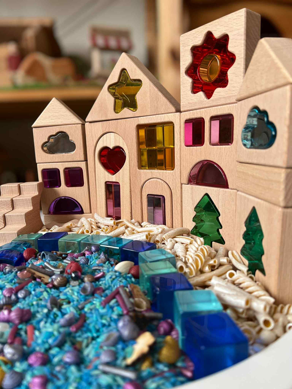 Close view of Dreamlight Village houses and trees in a staged play landscape