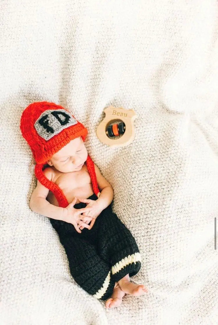Lifestyle photo showing a wooden baby rattle with a child