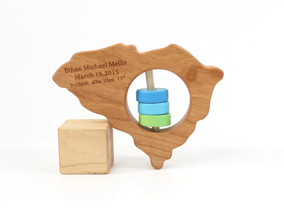 Bannor Toys South Carolina State Wooden Baby Rattle with example laser engraving and colored rattle discs