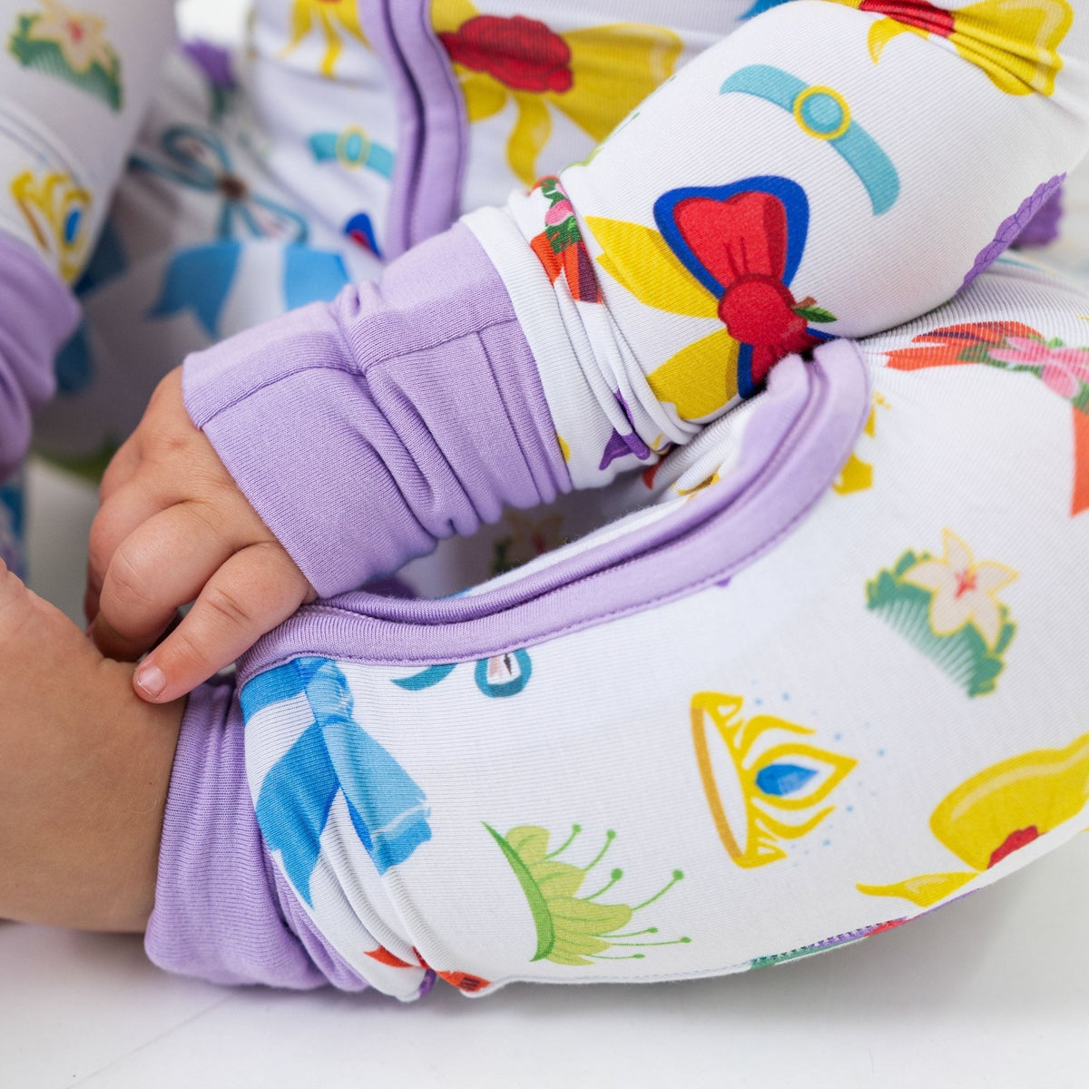Close-up of the wrist cuff and fabric on Bam & Stitch Sparkle & Reign Convertible Romper.