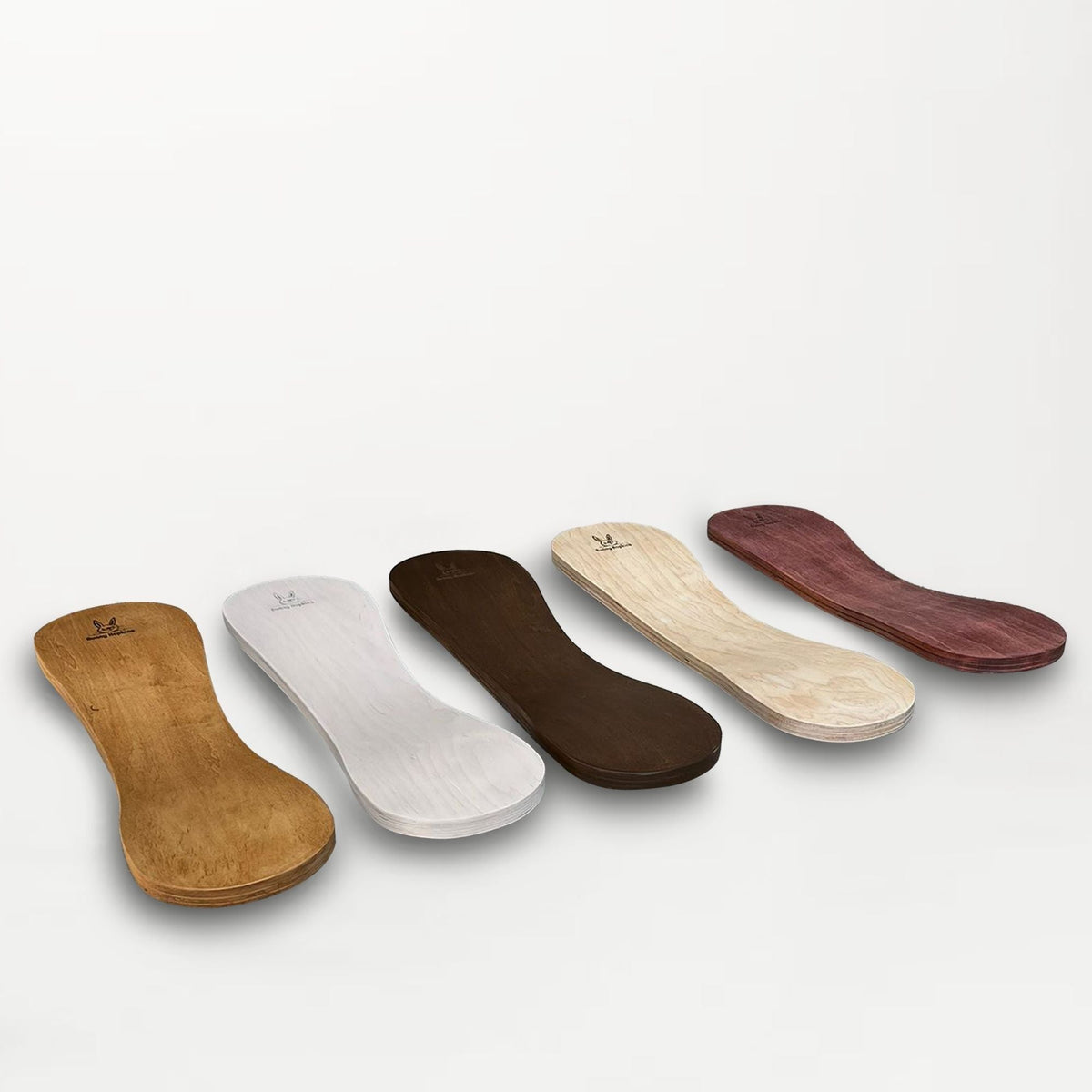 Five Spinzee boards displayed in tan, white, dark brown, pale natural and reddish-brown tones.