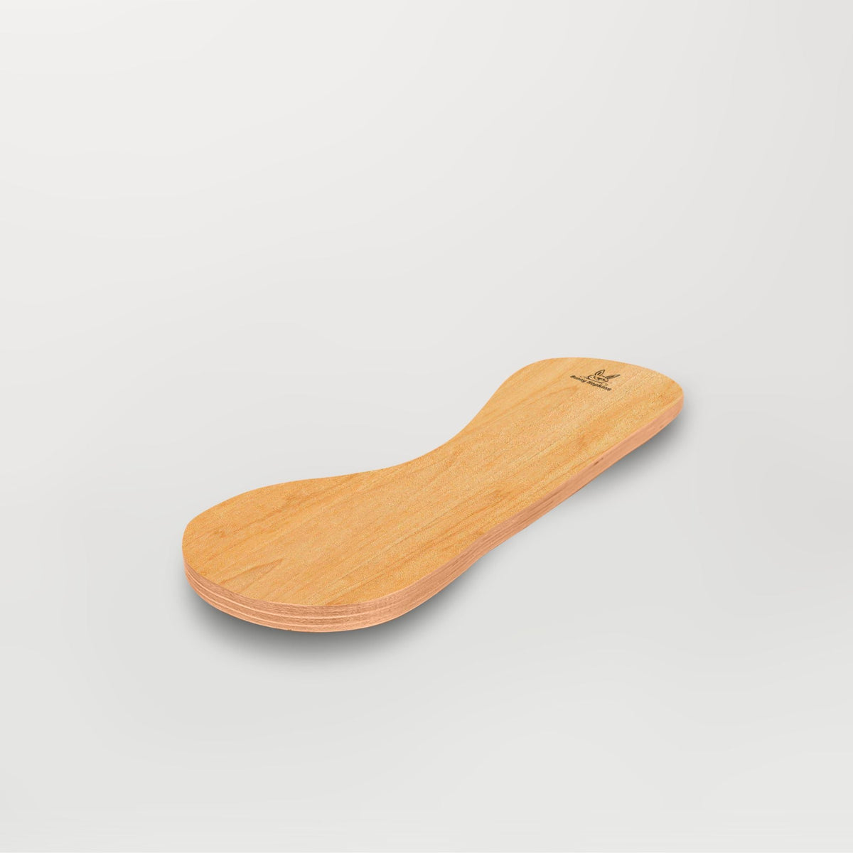 Golden-tan Spinzee board with visible grain, angled view.
