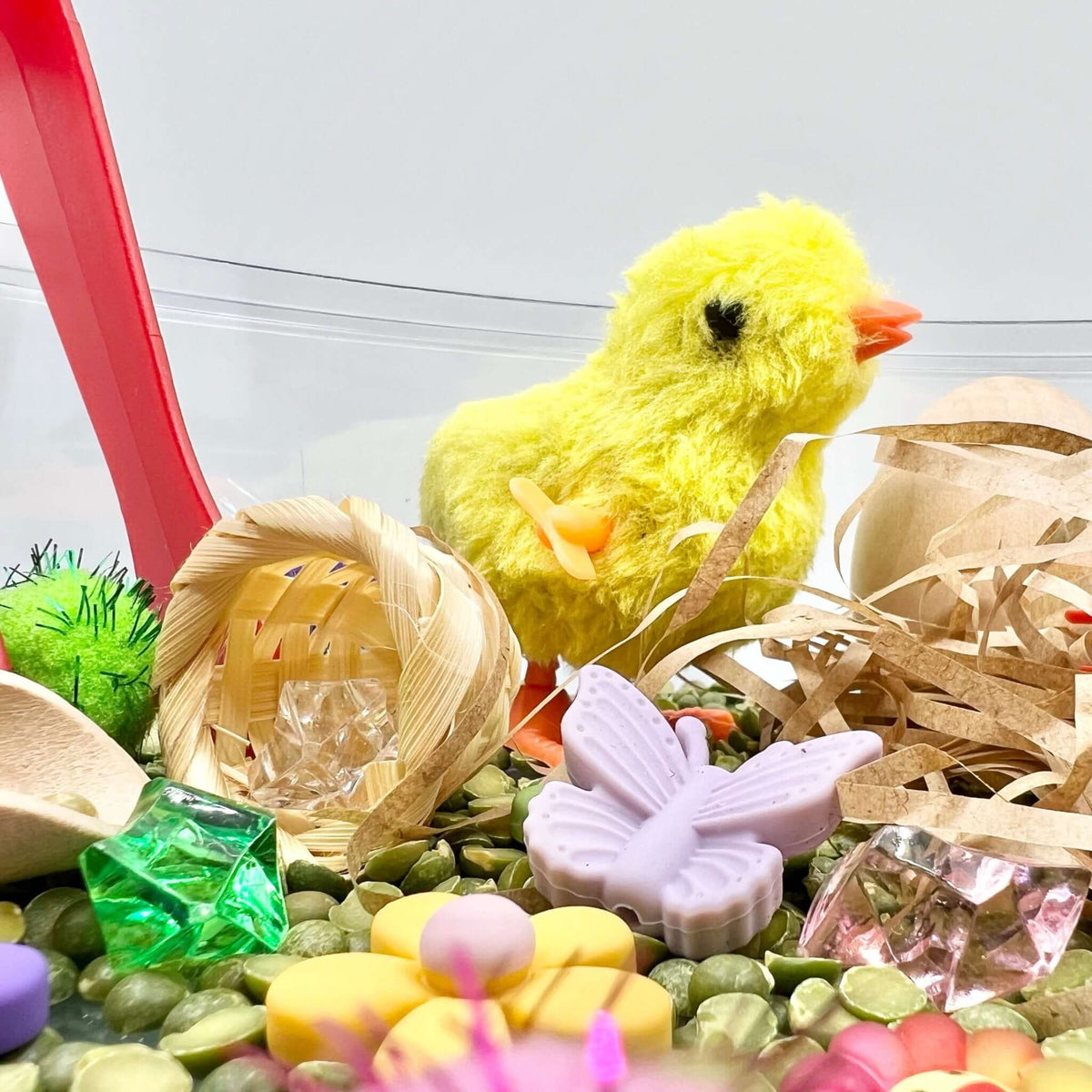 Yellow wind-up chick, basket, butterfly and flowers in the Spring Garden scene