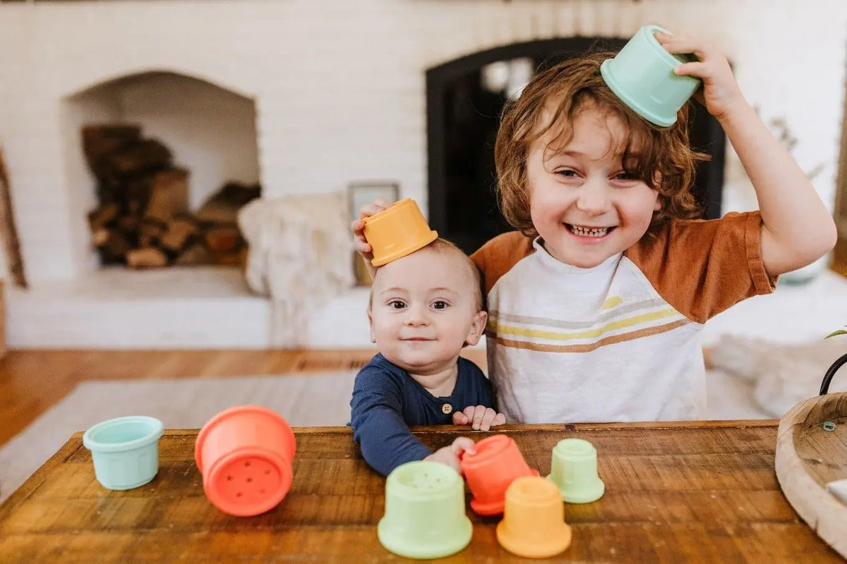Lifestyle photo showing silicone stacking toys with a child