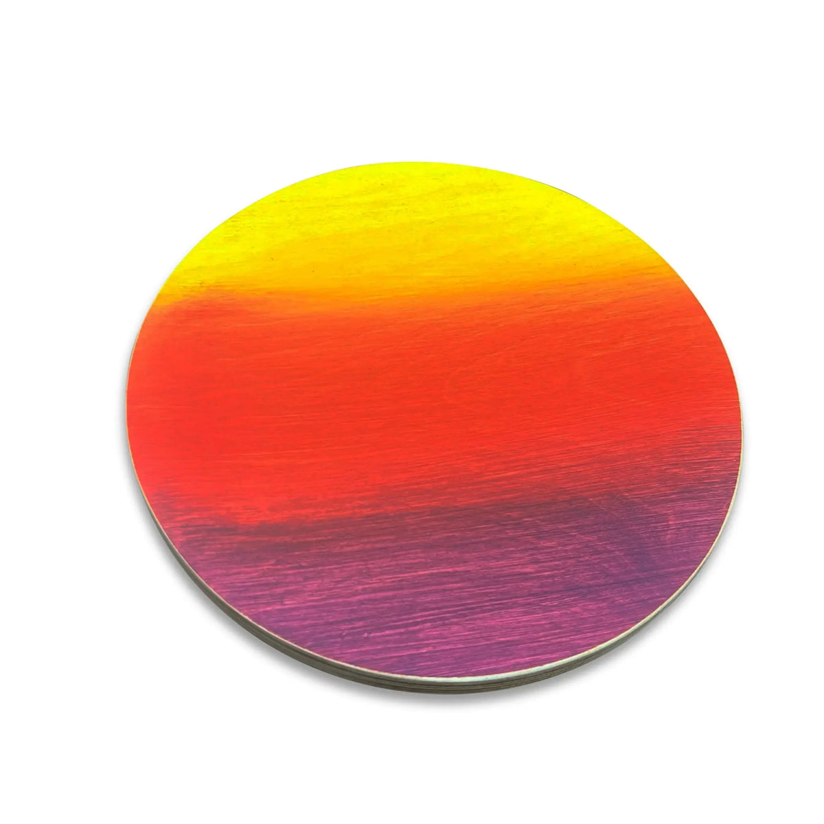 Close-up of a round stepping stone with a yellow, orange, red and purple gradient.