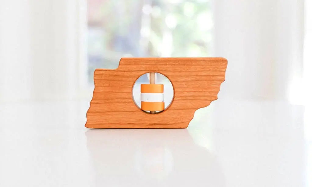 Bannor Toys Tennessee State Wooden Rattle, showing state-shaped cherry-wood body and colored rattle discs